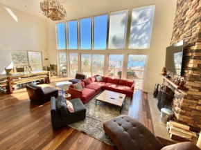 Modern 6 bedroom retreat, stunning lake views, close to village!
